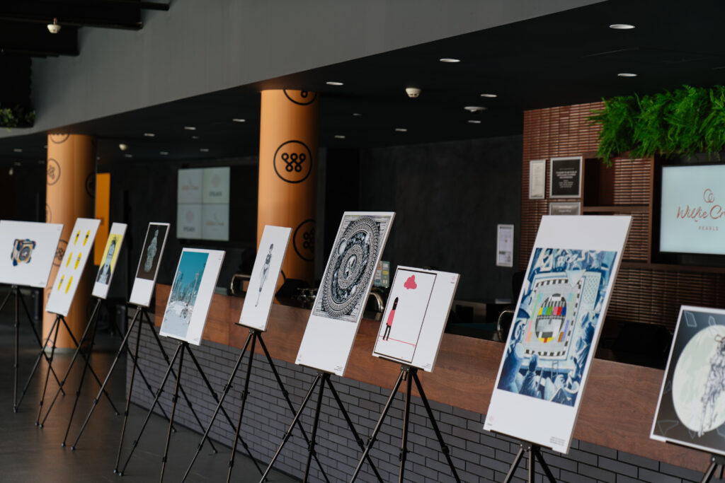 Framed artworks on easels along the venue foyer, State of Social ’21