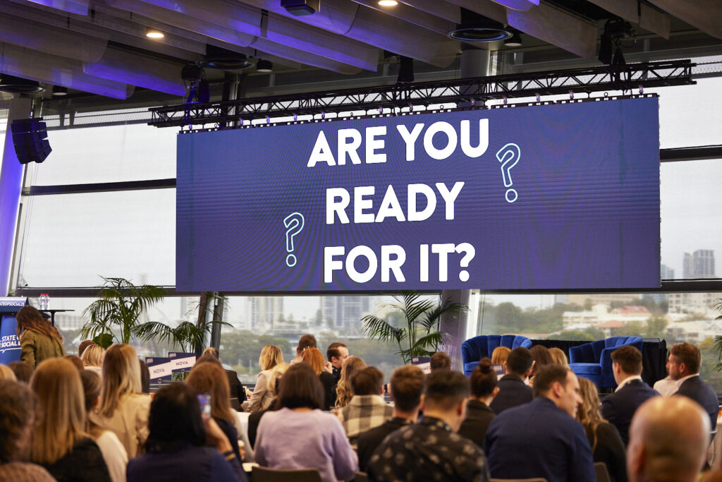 Delegates facing the main screen at SOS23