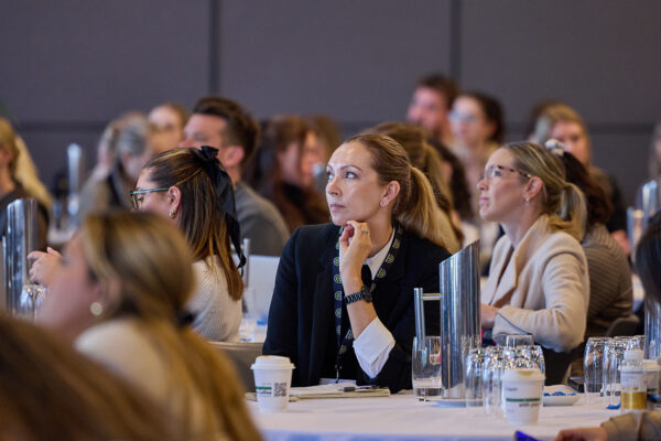 Delegates listen to a session at their tables, State of Social ’24