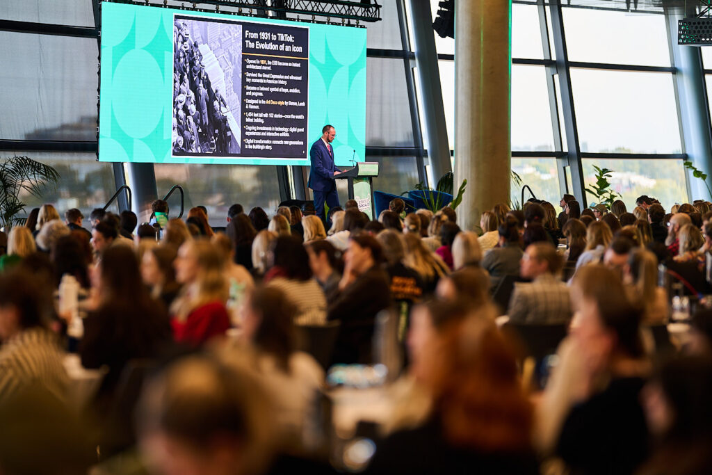Full audience watching a session with a slide on the screen, State of Social ’25
