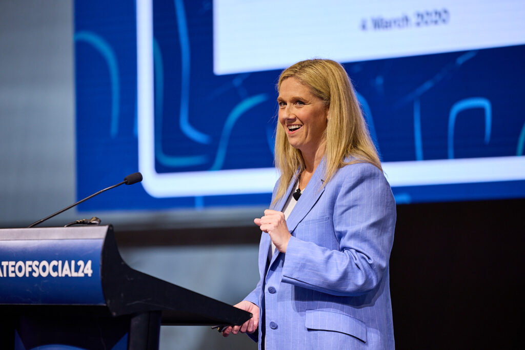 Meg Coffey speaking at the lectern at SOS24